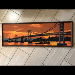 mid century bridge with city skyline